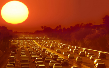 cars in traffic on highway under bruning sun